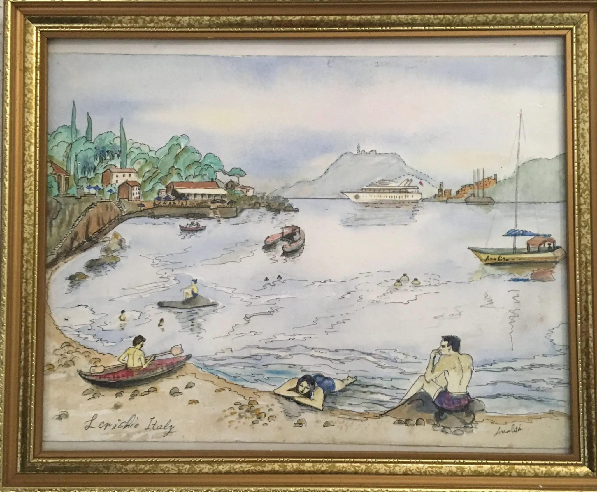 A watercolour of the Italian harbour at Lerici: a curved pebble beach with three figures and a small red rowing boat in the foreground, a pale bay dotted with moored boats and a distant cruise ship, green hills and a soft pastel sky behind.