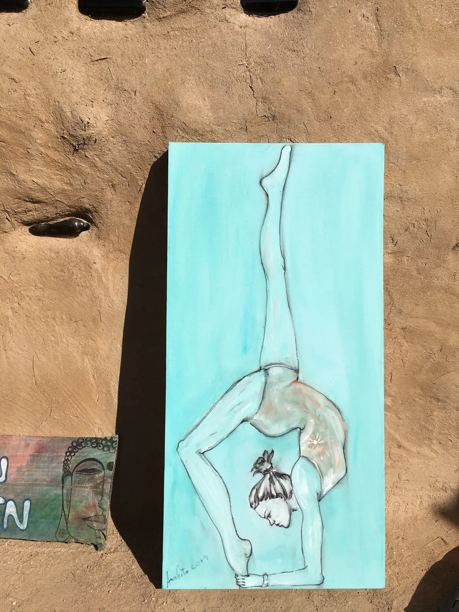 A pale figure balances in a deep backbend, one leg lifted straight to the sky, painted in soft greys and whites over a calm turquoise wash.