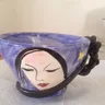 See Blue Cup with Sleeping Face standing at its real size