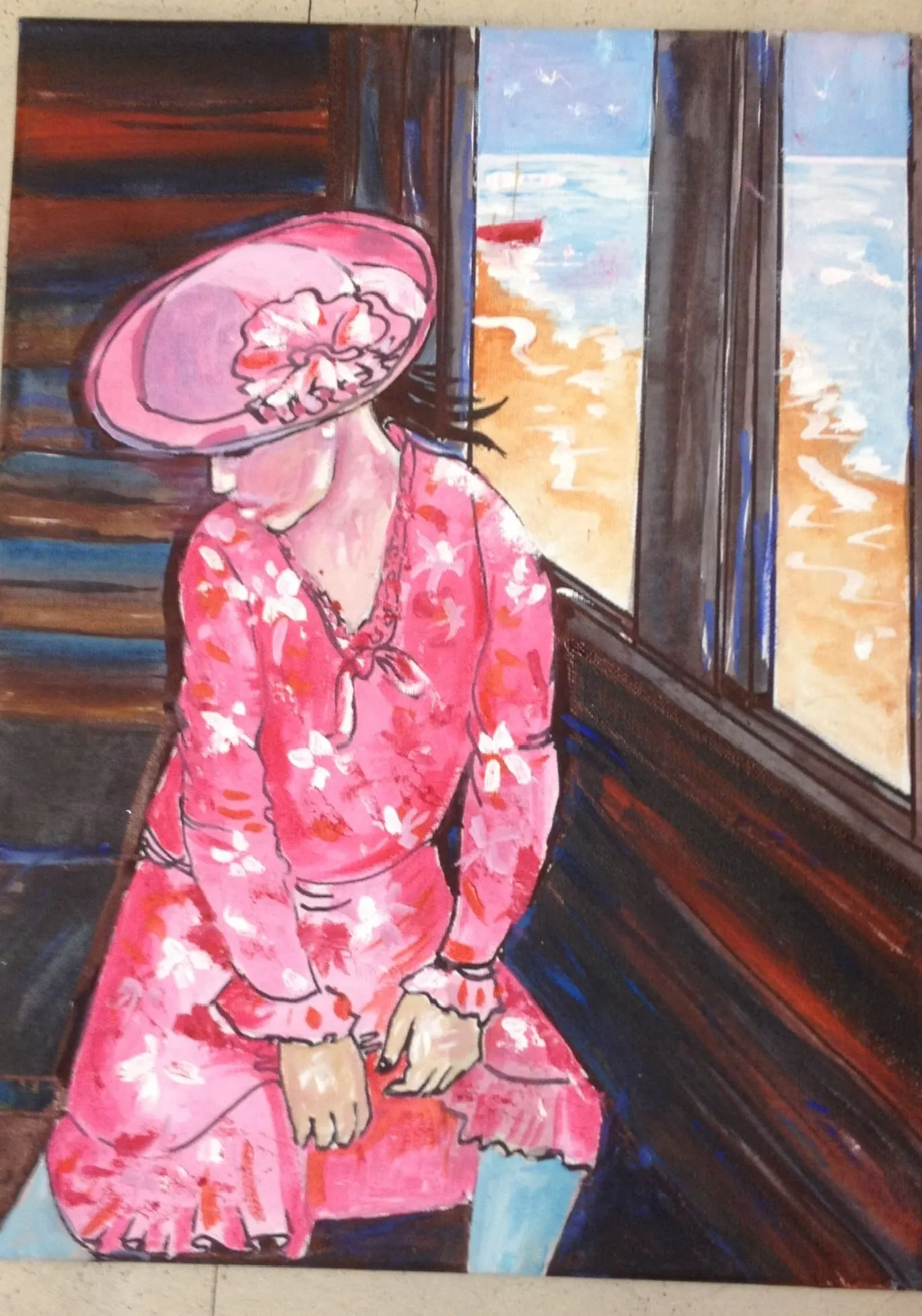 A woman in a wide-brimmed pink hat and long pink floral dress sits on a dark bench in a beach hut, her face left blank, with a red boat on a blue sea seen through the window.