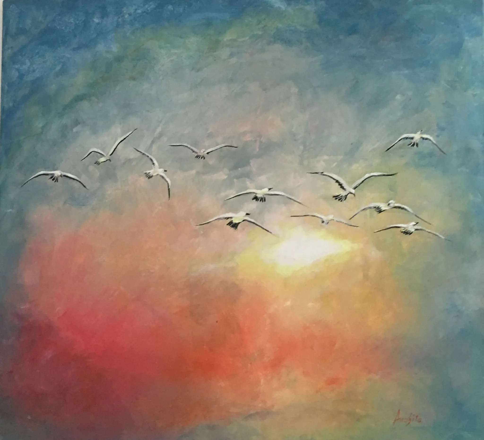 A flock of eleven white seabirds with dark wingtips crossing a broad glowing sky of coral, gold and blue, a soft white sun at the lower centre