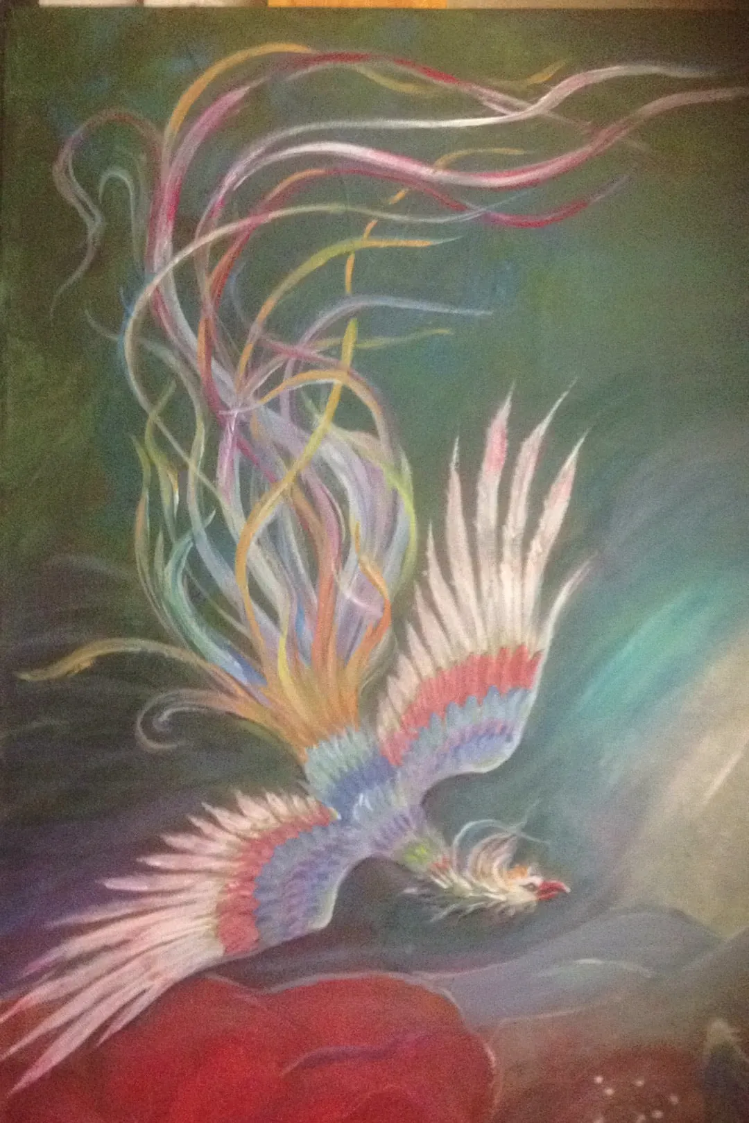 A mythical bird in flight against a deep green sky, wings banded in rose, lilac and cream, long ribbon tail feathers of pink, gold and white streaming upward from a small red form below