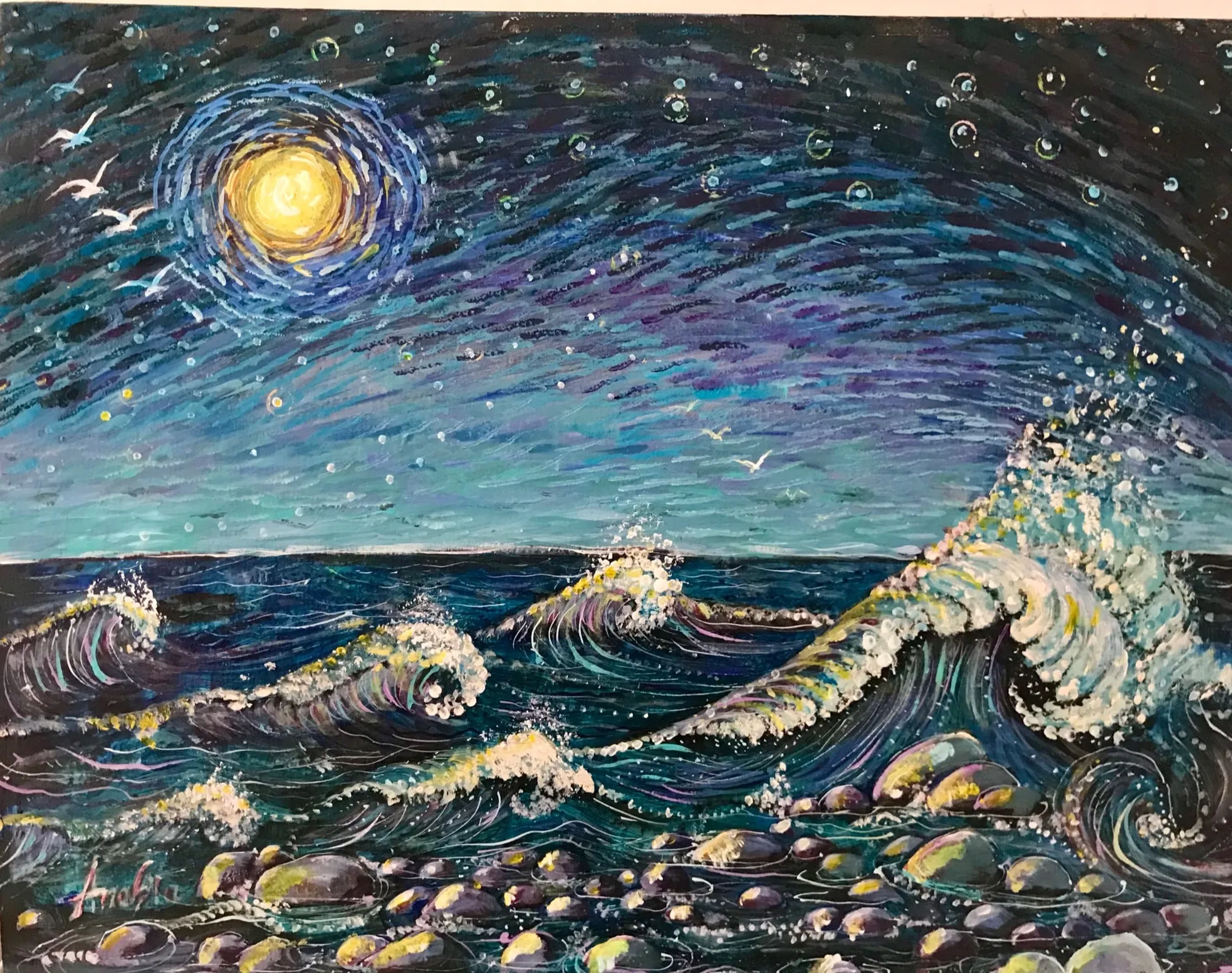A moonlit sea with a golden moon ringed in blue-violet strokes, three white gulls, rolling teal and cobalt waves breaking, and multicoloured wet pebbles along the shore