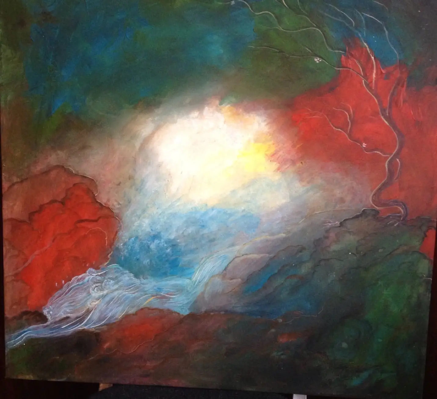 Abstract canvas with a golden white core of light emerging between deep red and forest green cloud forms, pale blue and silver waves flowing across the lower edge
